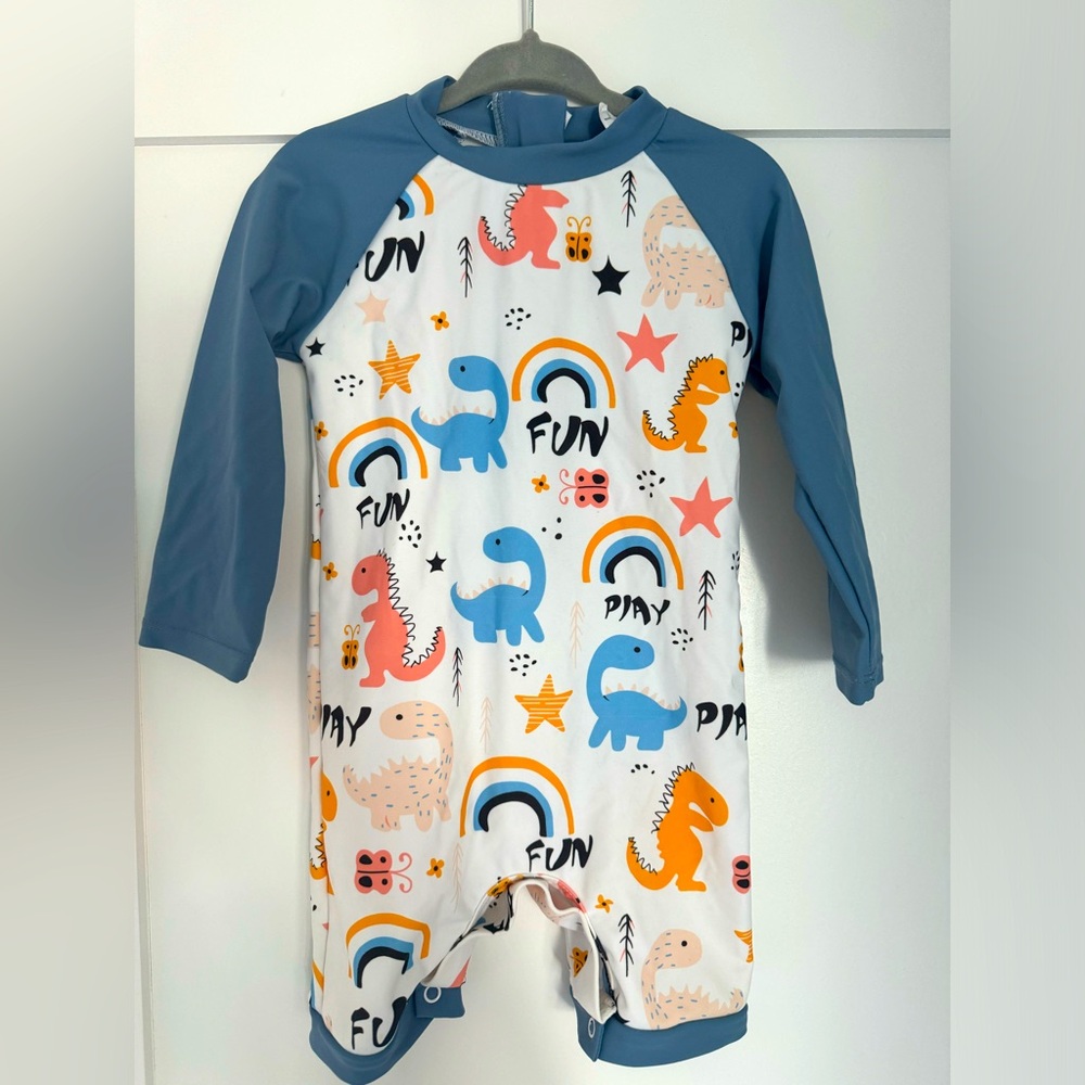 One piece rashguard + hat dinosaur print, long sleeve, shorts to keep knees